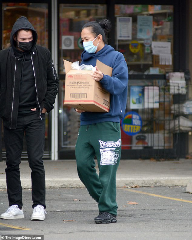 Spotted: Alexander Wang (right) joined a man's companion at an Asian supermarket in Skarsdale, New York on Monday in his first sighting since he denied numerous allegations of assault and sexual harassment.