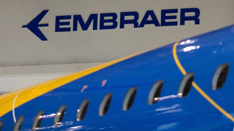 FILE PHOTO: The logo of Brazilian planemaker Embraer SA is seen at the company