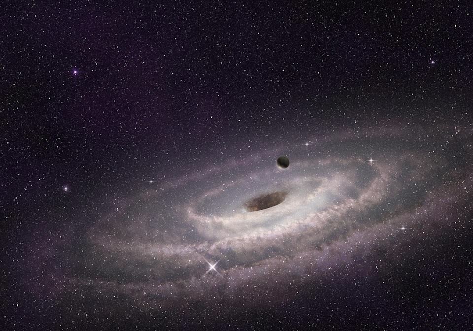Buraco negro supermassivo no centro de uma galáxia espiral
