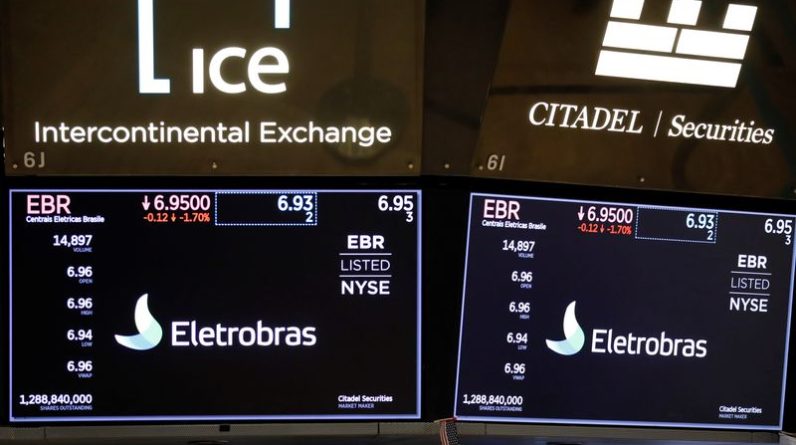 FILE PHOTO: Logos of Eletrobras, a hydroelectric power generation company based in Brazil, is seen on the floor at the New York Stock Exchange (NYSE) in Manhattan