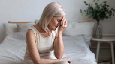 Older woman stressed, possibly from menopause